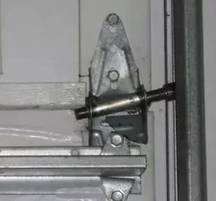 Garage door hinge and roller bracket replacement